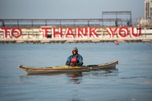 Chev Dixon sitting in a kayak on the water